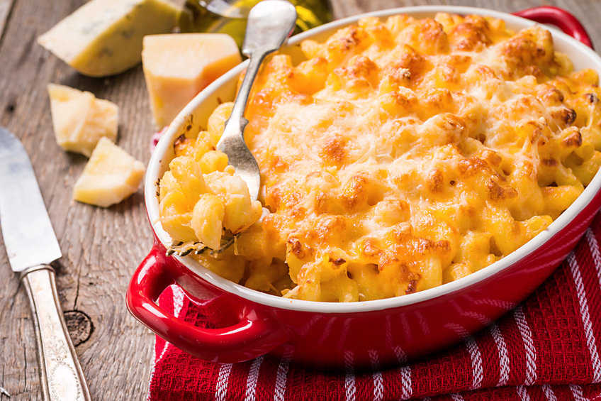 Homemade macaroni and cheese in a red casserole dish